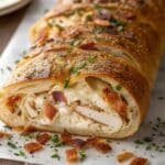 Chicken Bacon Ranch Stromboli sliced showing cheesy filling