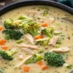 Creamy chicken broccoli soup in a rustic bowl