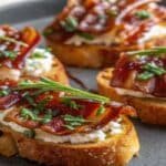 Million Dollar Bacon Crostini appetizer on a rustic board.