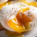 poached eggs with runny yolks on artisan toast