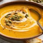 Roasted Butternut Squash Soup: Velvety-Creamy Fall Comfort Roasted Butternut Squash Soup oasted Butternut Squash Soup with cream swirl and pepitas